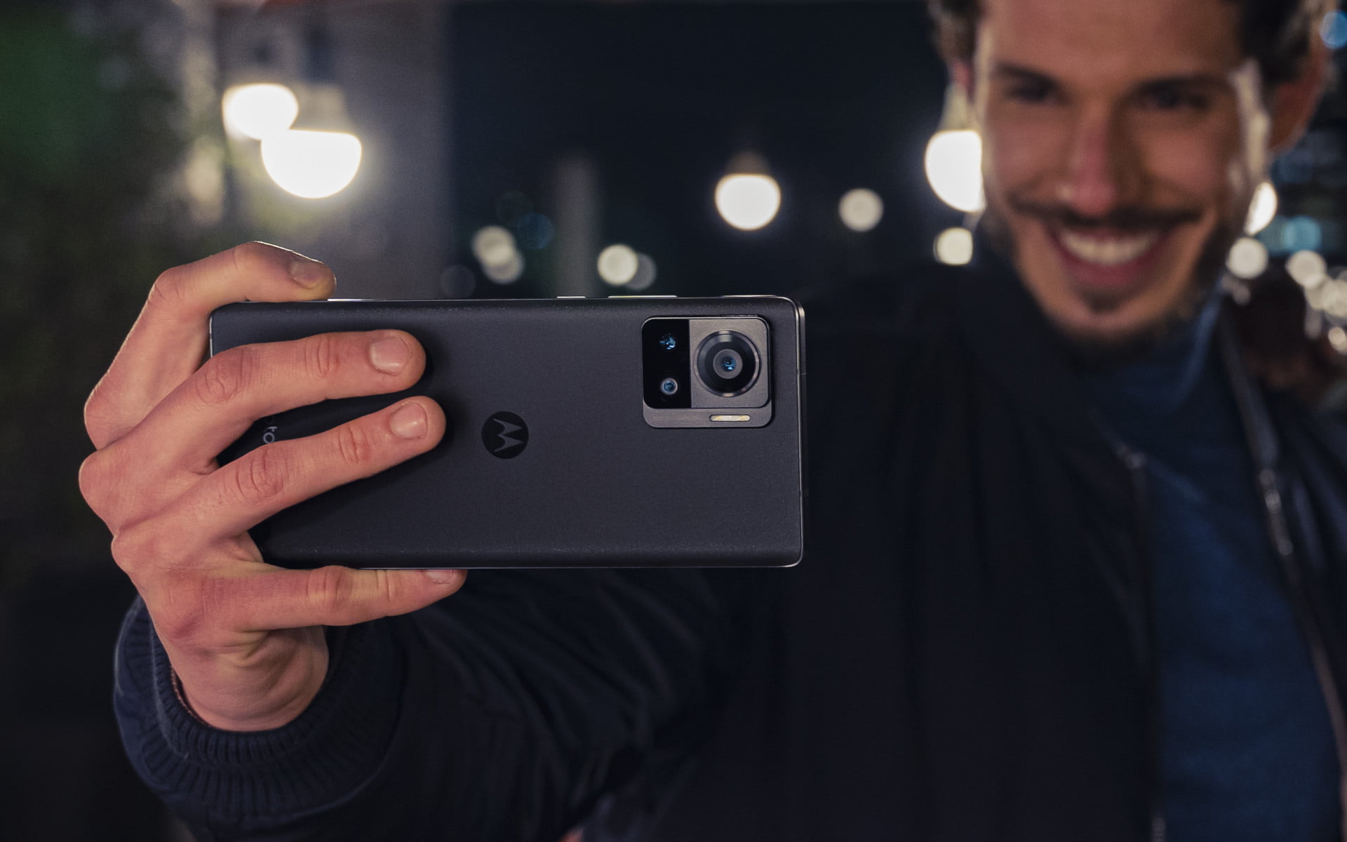 Motorola Edge 30 Ultra Man holding smartphone