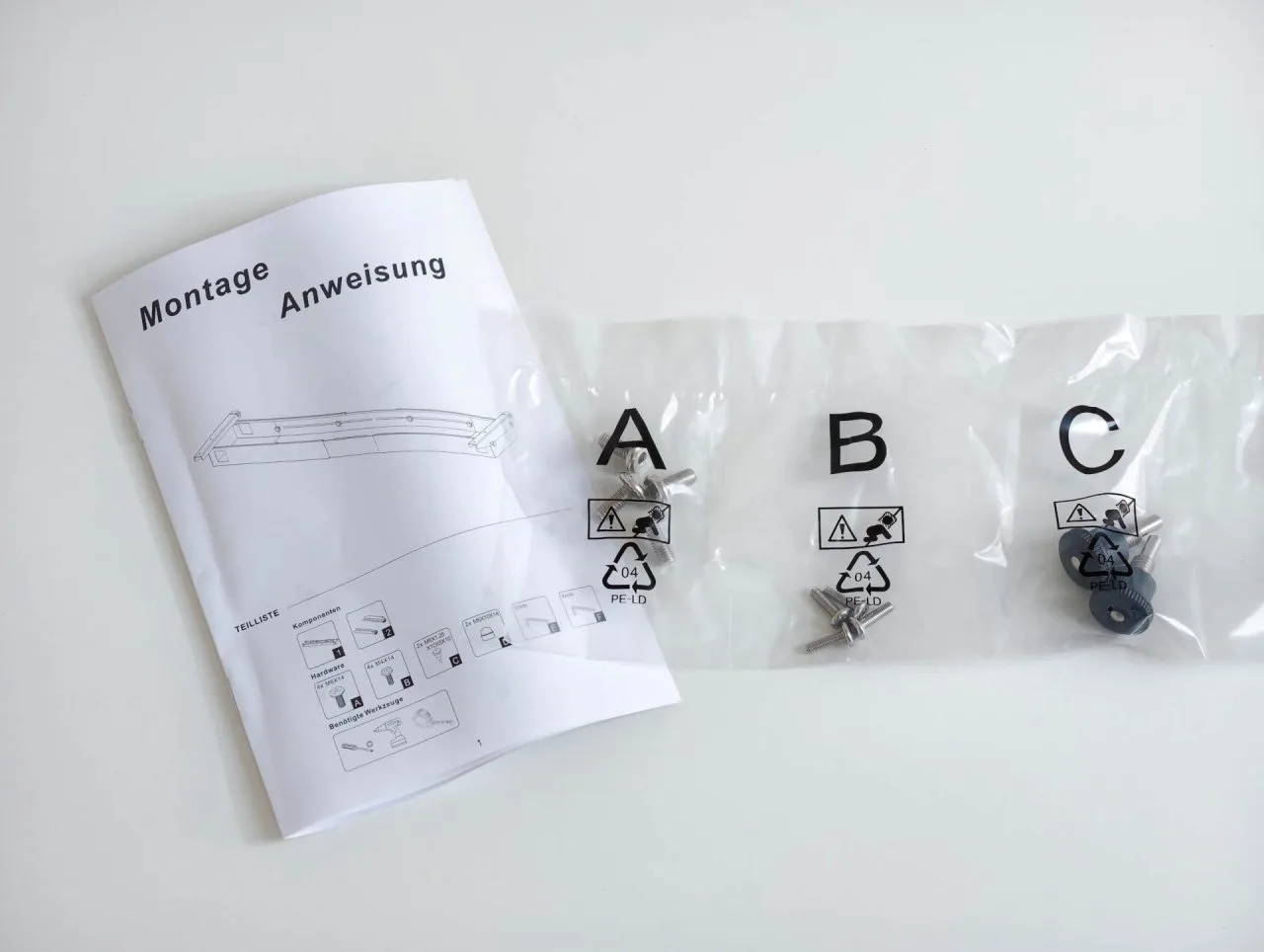 Montage-instructies en alfabetisch gesorteerde schroeven voor de Esslinger VexelLine